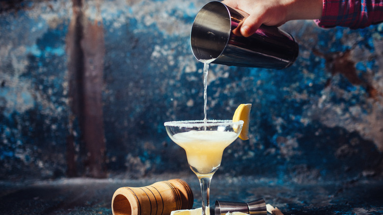 margarita being poured from shaker
