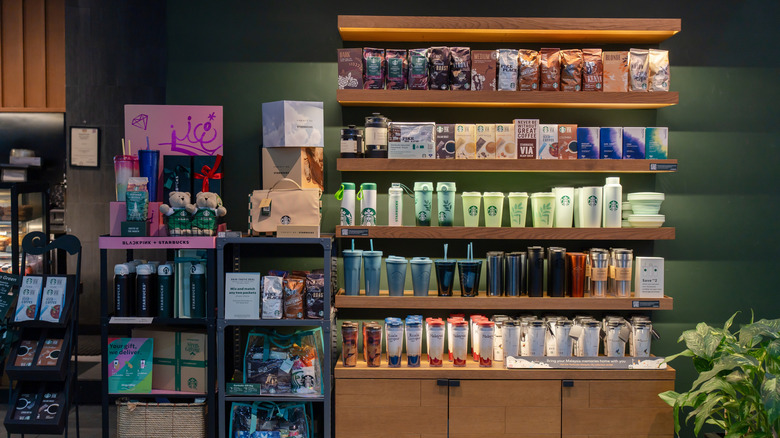 Starbucks coffee merchandise on the shelf.