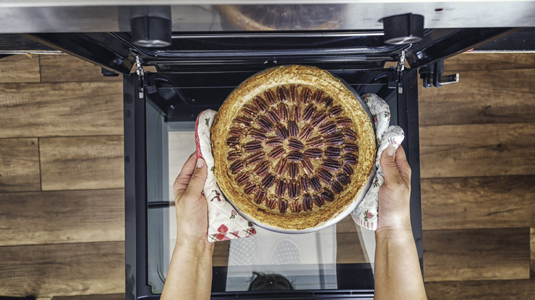 Pecan pie going in the oven