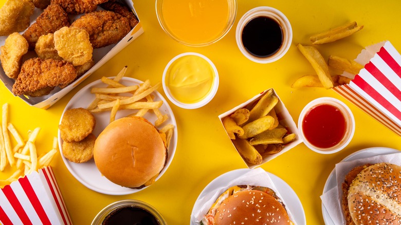 Various fast food items on yellow background