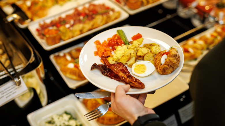 diner eating at breakfeast buffet